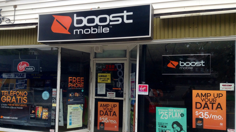 A small Boost Mobile store in a strip mall