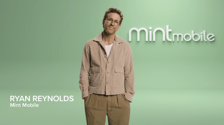 Ryan Reynolds in a green room with the Mint Mobile logo