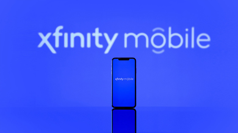 An Xfinity Mobile logo with a smartphone in the foreground, also displaying the Xfinity logo