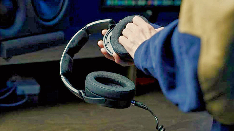 A man holding the Sennheiser HD 490 Pro headphones.