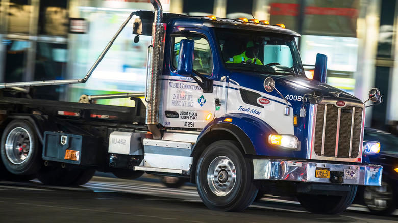 A blue Peterbilt 567 truck in New York, using the Cummins X15 engine