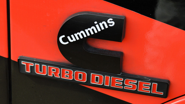 cummins turbo diesel badging on an unidentified red vehicle