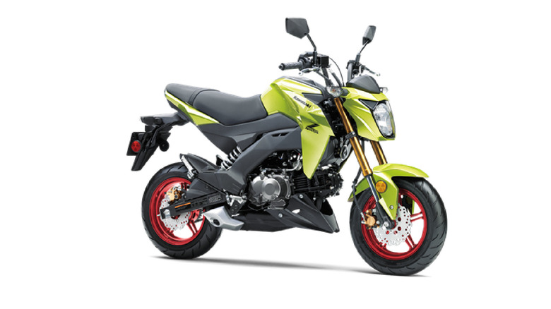 A green and black Kawasaki KZ125 Pro motorbike for the 2026 model year parked against a white studio background.