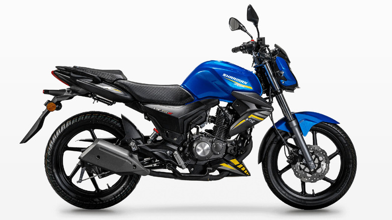 A black an blue Sharmax RST 150 Ultra for the 2026 model year, side profile, against a white studio backdrop.