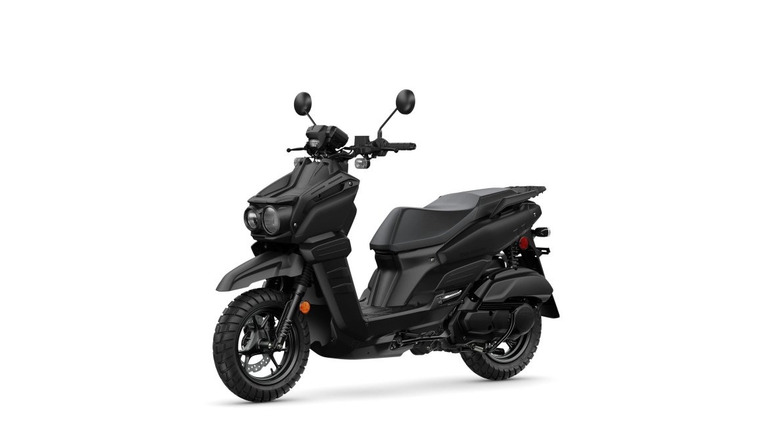 The left-focused view of an all-black 2026 Yamaha Zuma against a white background.