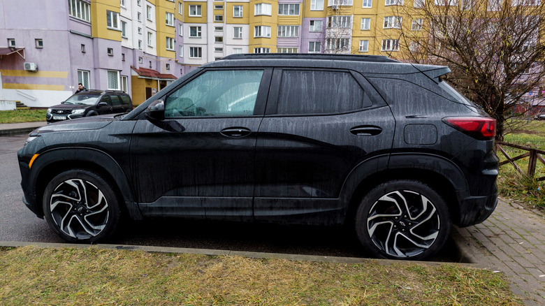 Black 2026 Chevrolet Trailblazer in a residential area.