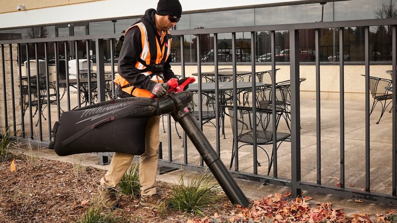 cleaning up landscaping with Milwaukee mulching vacuum