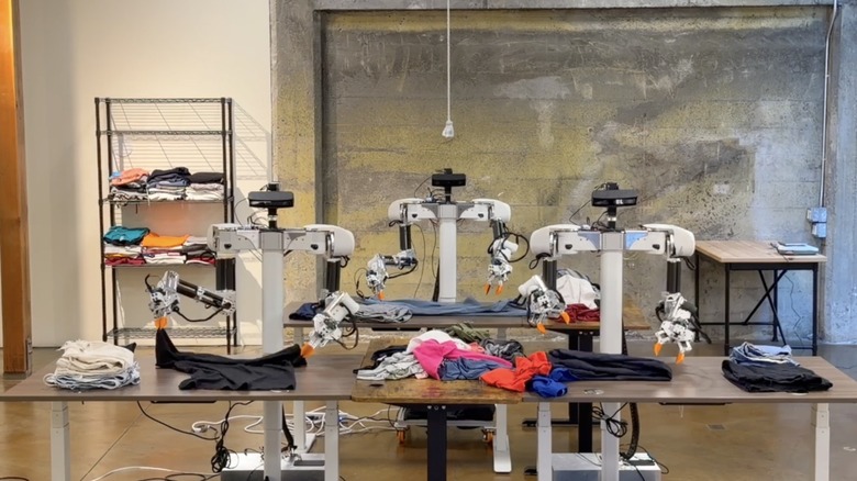 A trio of laundry-folding robots from Weave Robotics.