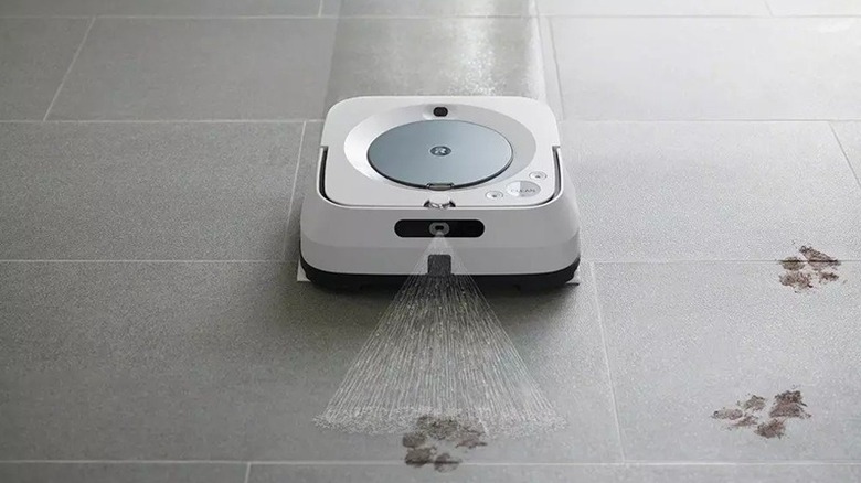 An iRobot Braava cleaning pet printson the floor.