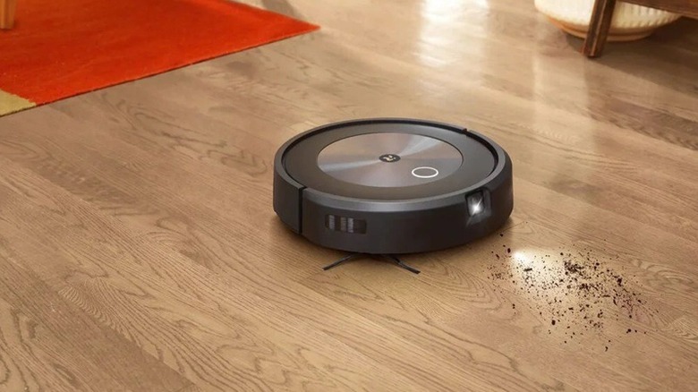 A Roomba from iRobot cleaning home floor.