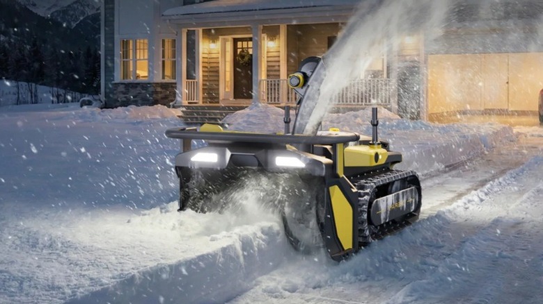 Yarbo autonomous snow removeal robot plowing snow in front of a house.