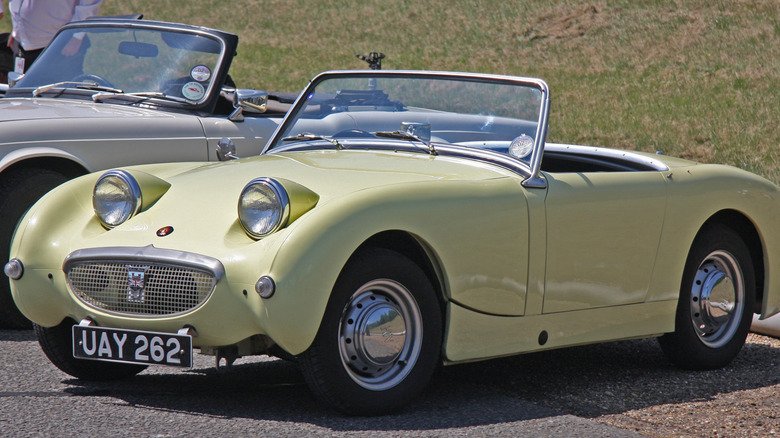 Yellow Austin-Healey "Bugeye" or "Frogeye" Sprite parked outdoors