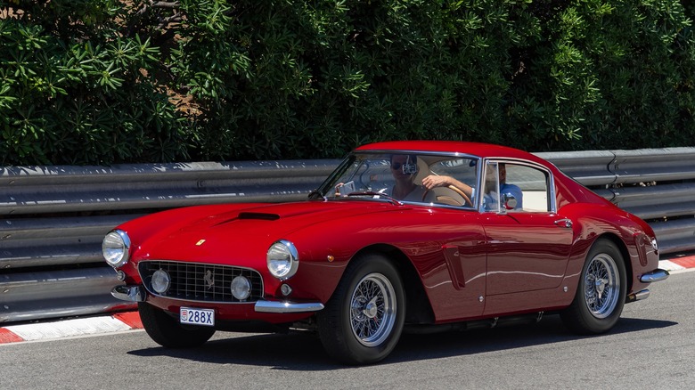 Red Ferrari 250 GT SWB driving on a track