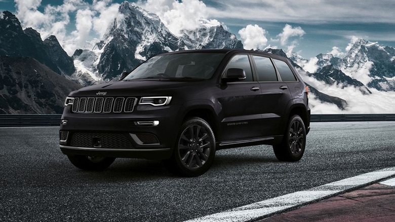A black Jeep Grand Cherokee S on a mountain road
