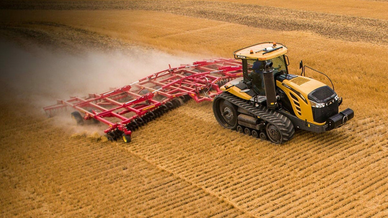A yellow Challenger MT800 on a farm