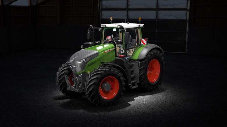A green Fendt 1050 Vario with red wheels