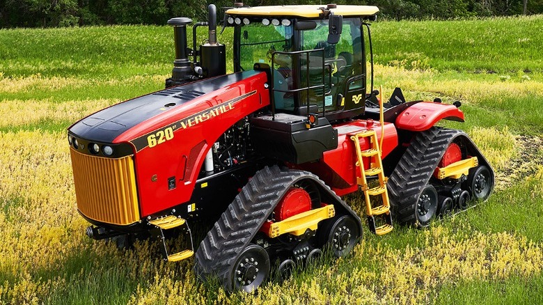 A red and yellow Versatile DT tractor