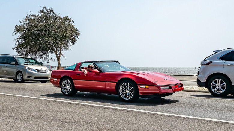 A red Chevrolet Corvette ZR-1 going for a drive by the water
