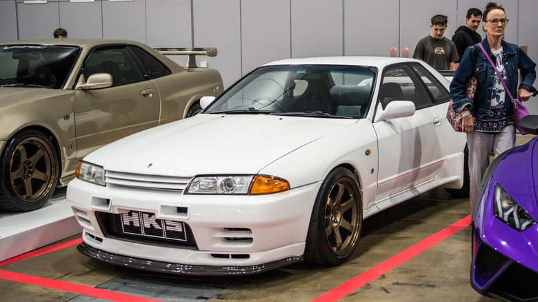 A white Nissan Skyline GTR at a sports car show