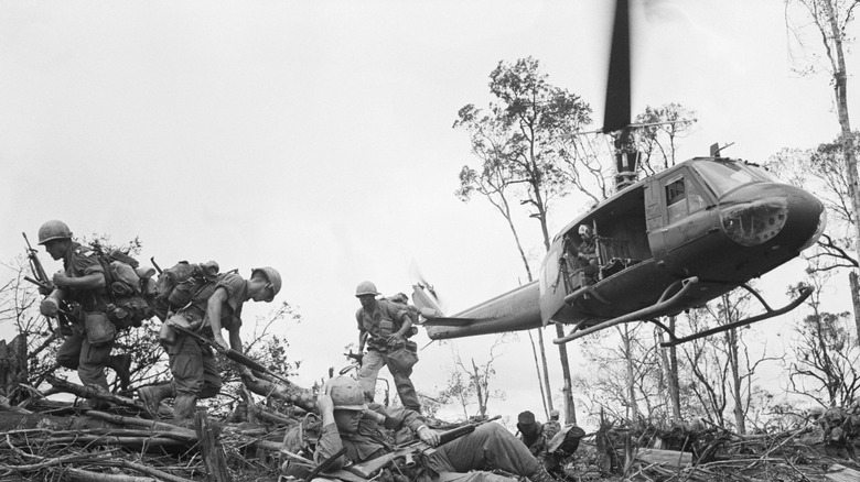 American troops inserting into Vietnam aboard a Bell UH-1 Huey