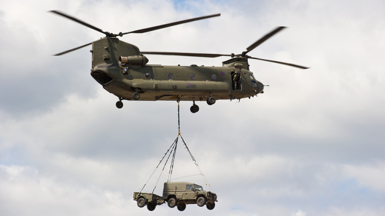 CH-47 Chinook helicopter tranpsorting vehicles