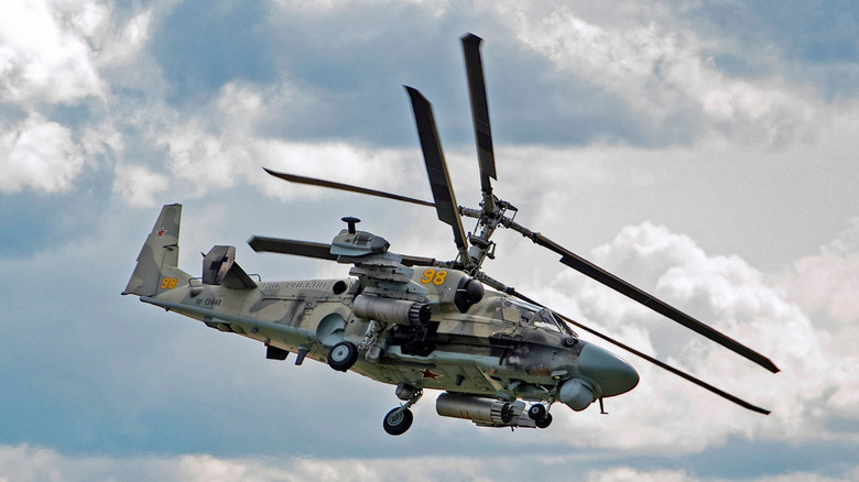 Russian Ka-52 attack helicopter in banking turn.