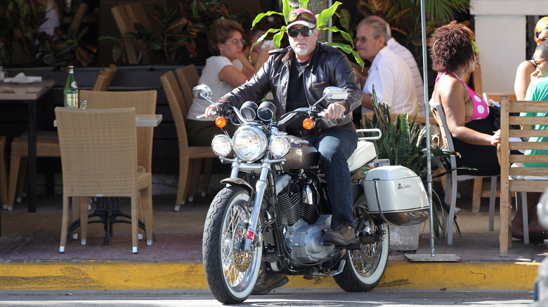 Billy Joel riding a motorcycle