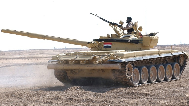 An Iraqi Army T-72 preparing to fire its gun in the desert in 2006.