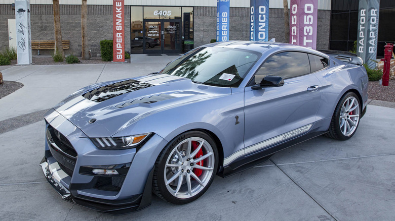 Gray Ford Mustang Shelby GT500KR parked in front of building