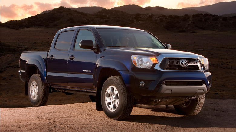 A side on shot of a blue 2015 Toyota Tacoma