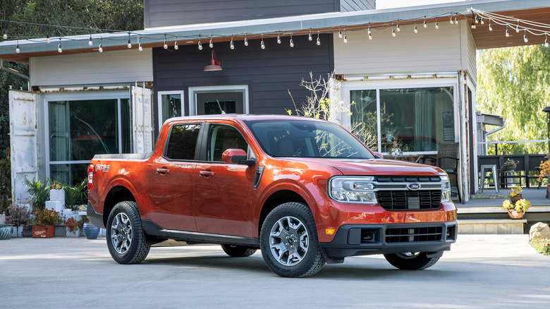 A side on shot of an orange 2022 Ford Maverick parked