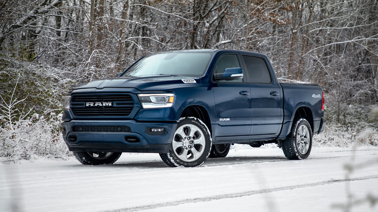 A side shot of a blue 2020 Ram 1500 parked