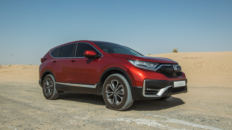 A red 2021 Honda HR-V parked in a desert