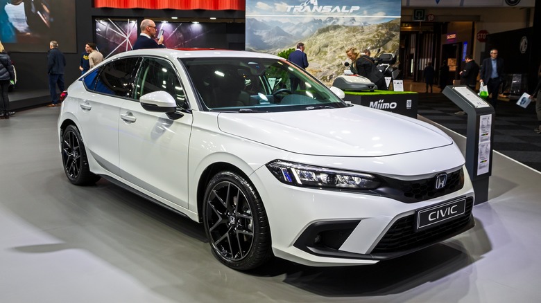 A white 2023 Honda Civic on display
