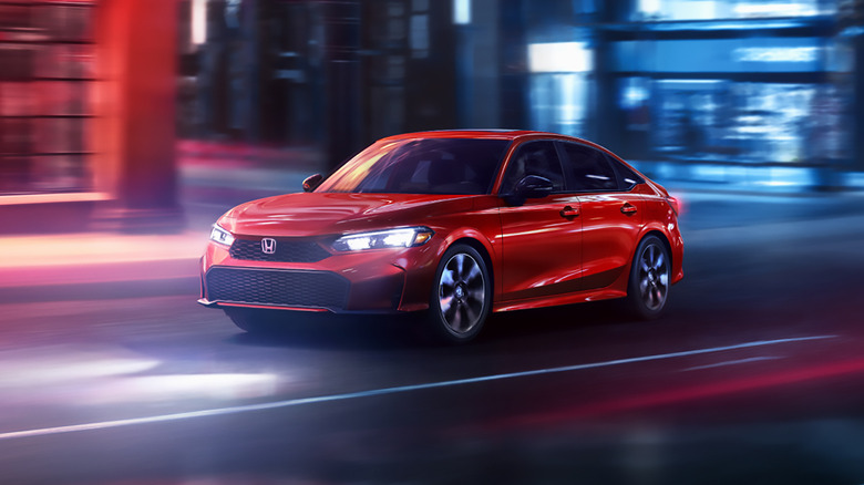 A red 2025 Honda Civic driving