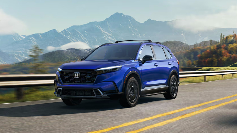 A blue 2025 Honda CR-V driving