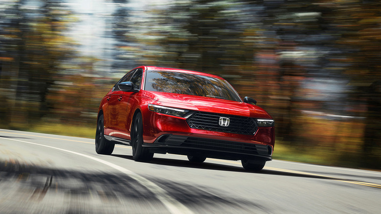 A red 2023 Honda Accord driving