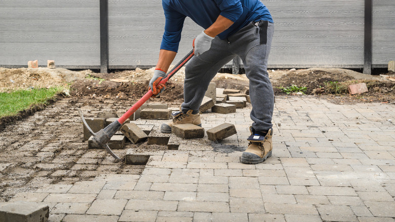 man using a mattock