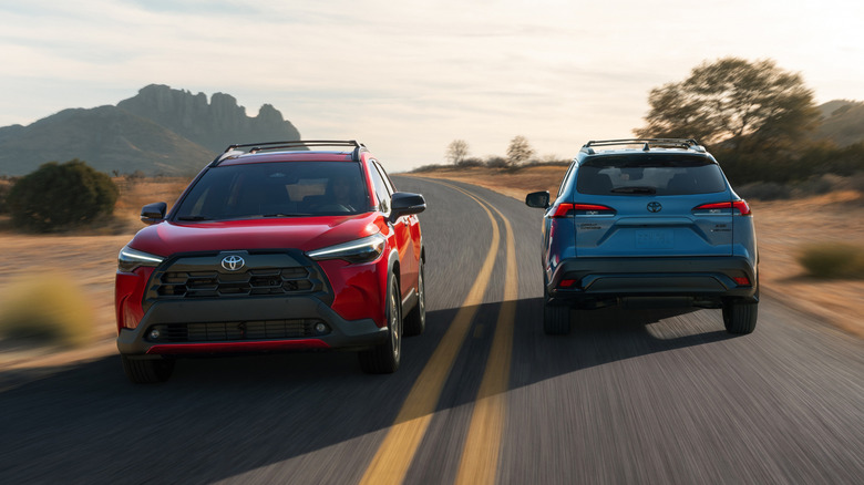 Two Toyota Corolla Cross driving in opposite directions