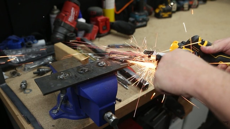 Person using DeWalt bandfile