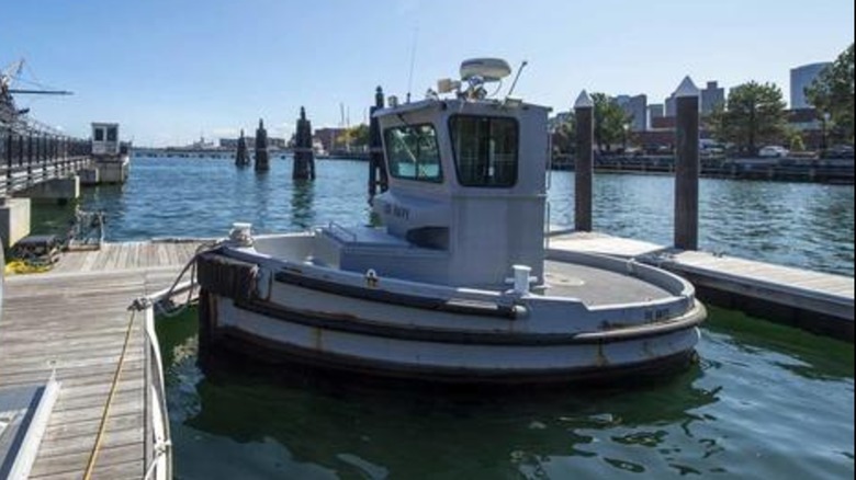 A "Boomin Beaver" security tug boat docked