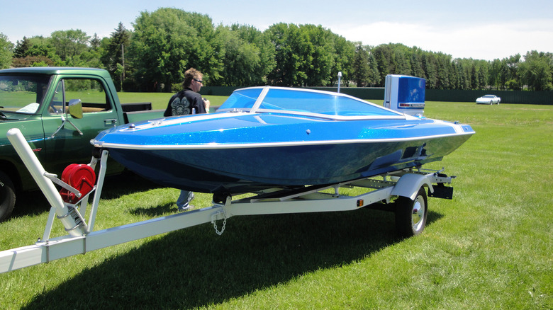 A 1972 Chrysler Conqueror boat on a trailer