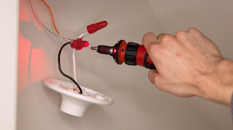 person holding Skil cordless screwdriver