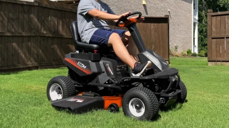 Person using Yard Force riding lawn mower