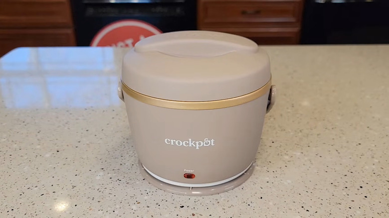 A Crockpot Food Warmer on display