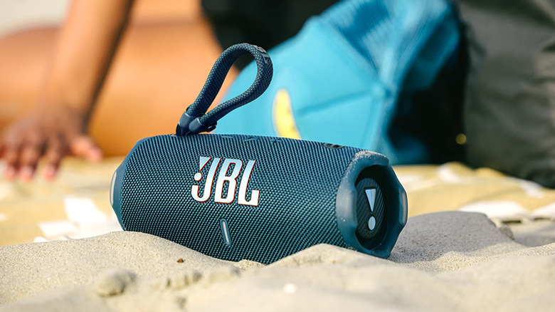 A JBL Charge 6 on a beach