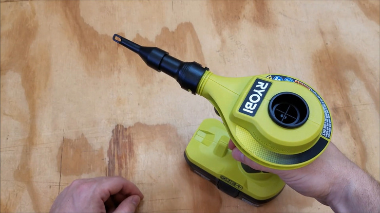 A Ryobi ONE+ Cordless Inflator on display