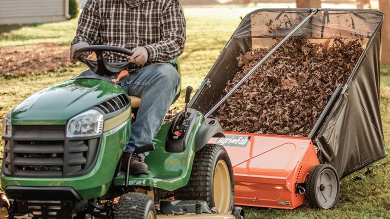 towing Agri-Fab sweeper on a riding mower