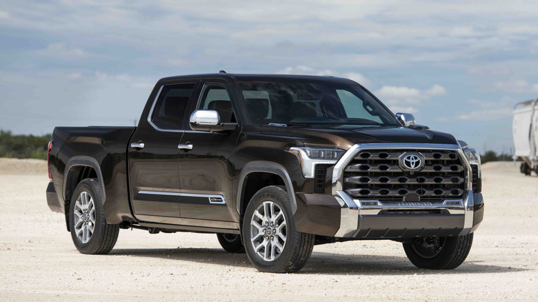 Black Toyota Tundra parked on dirt