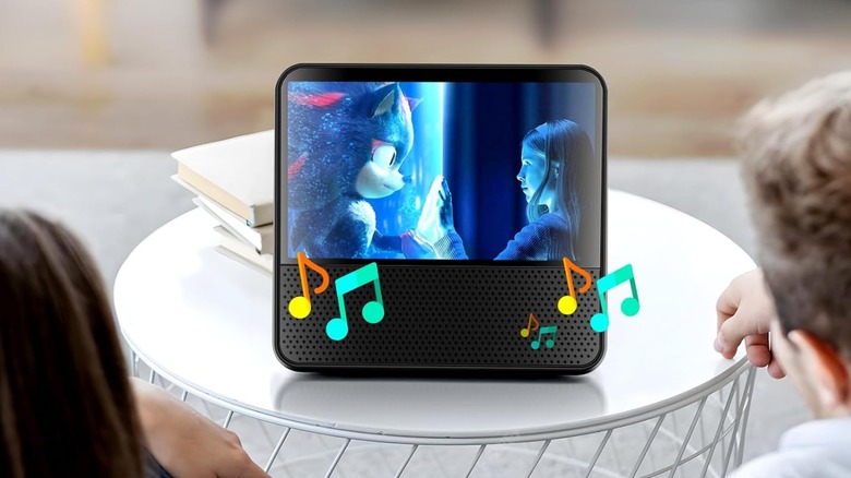 A portable DVD player showing a scene from "Sonic the Hedgehog 3" for two people